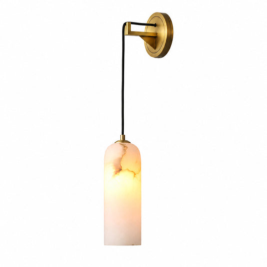 Dischetto alabaster wall sconce with a compact disc-shaped natural stone shade glowing warm on a wall