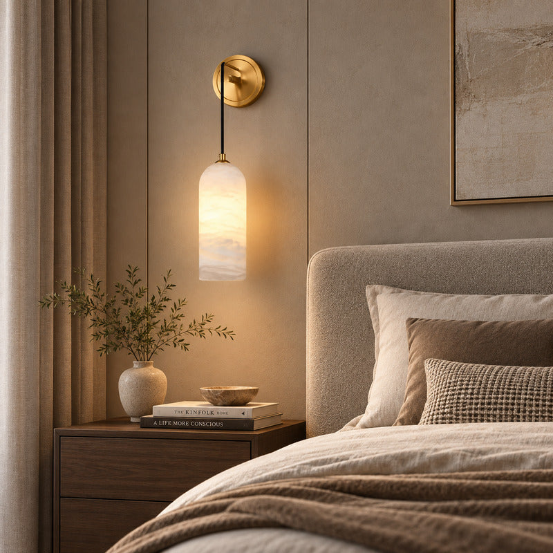 Pair of Dischetto alabaster wall sconces flanking a bed for warm symmetrical bedside lighting