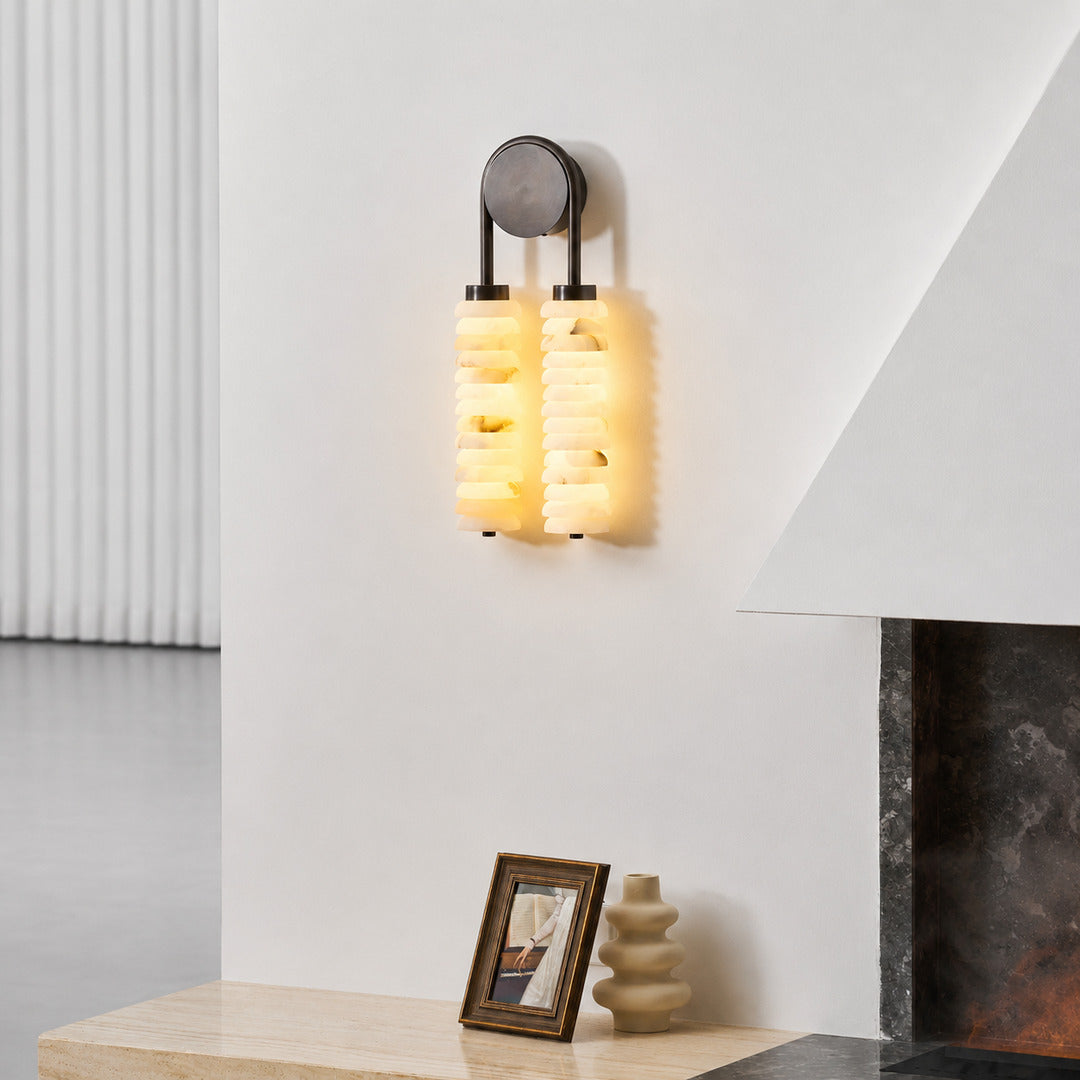 Duetto alabaster wall sconce as a warm sculptural accent on a modern living room feature wall