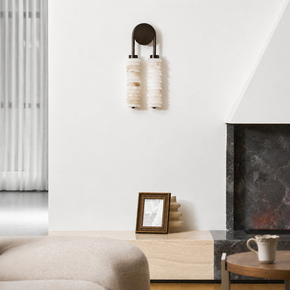 Duetto alabaster wall sconce as a warm sculptural accent on a modern living room feature wall