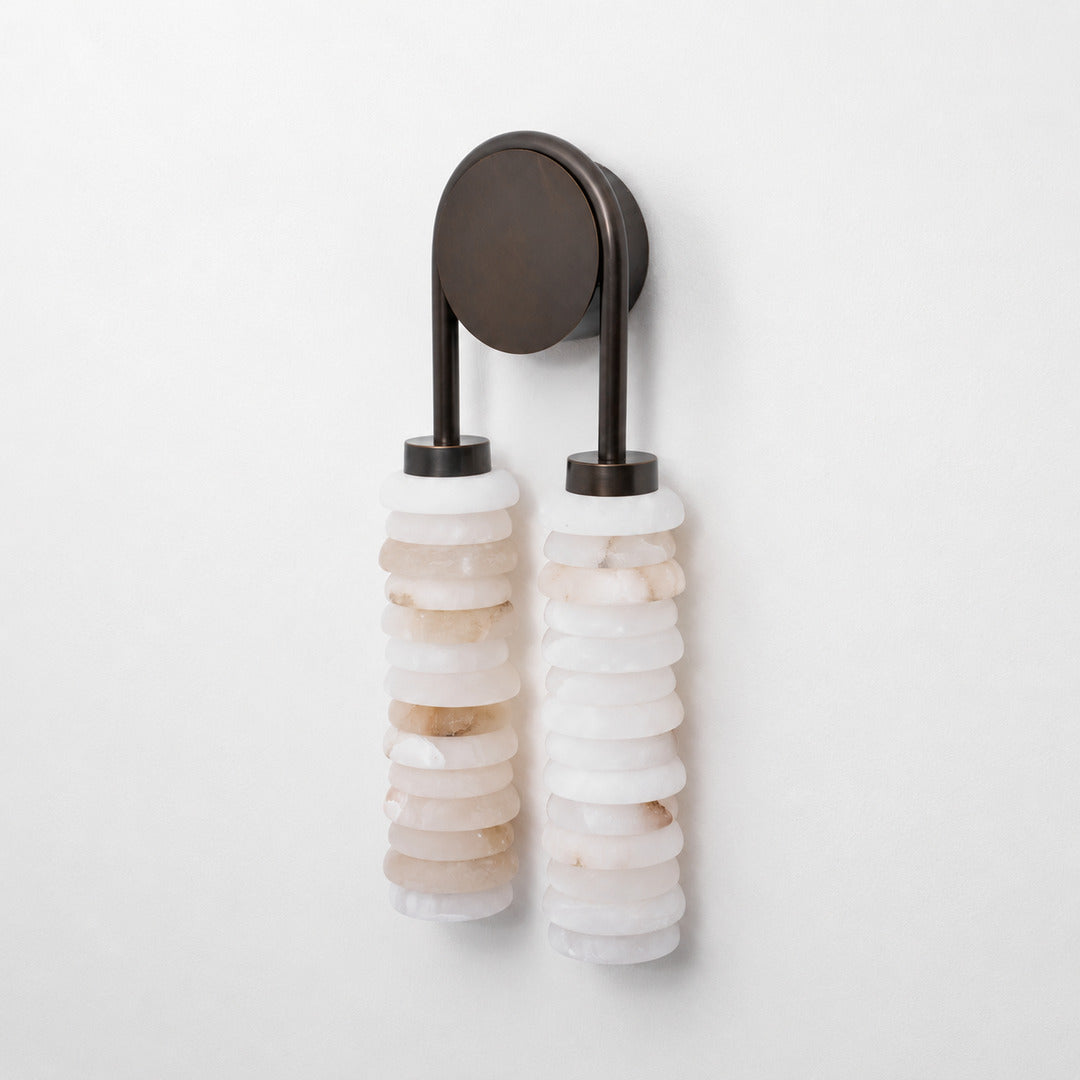 Close-up of the two parallel ribbed alabaster columns on the Duetto wall sconce