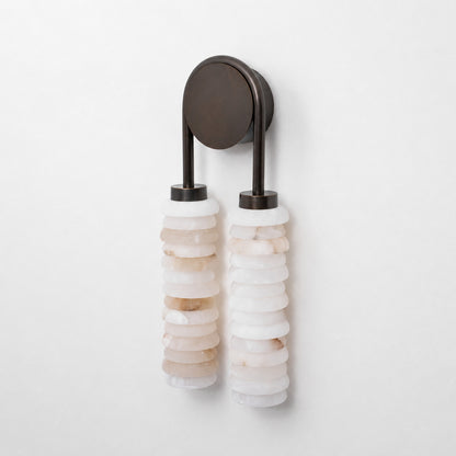 Close-up of the two parallel ribbed alabaster columns on the Duetto wall sconce