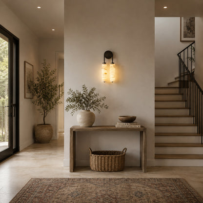 Duetto alabaster wall sconce lighting a staircase wall with a soft natural-stone glow