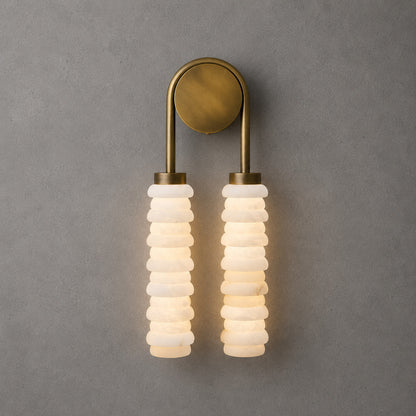 Antique brass Duetto alabaster wall sconce as a warm sculptural accent on a hallway wall