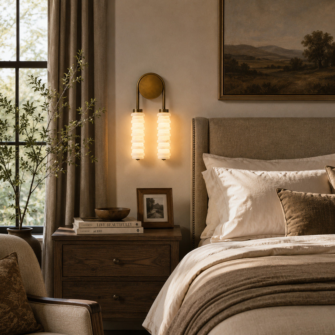 Pair of Duetto alabaster wall sconces flanking a headboard for warm symmetrical bedside light