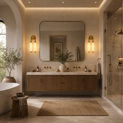 Duetto alabaster wall sconces flanking a vanity mirror in a dry powder room