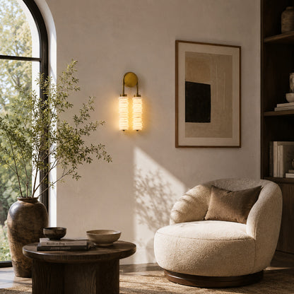 Pair of Duetto alabaster wall sconces flanking a headboard for warm symmetrical bedside light