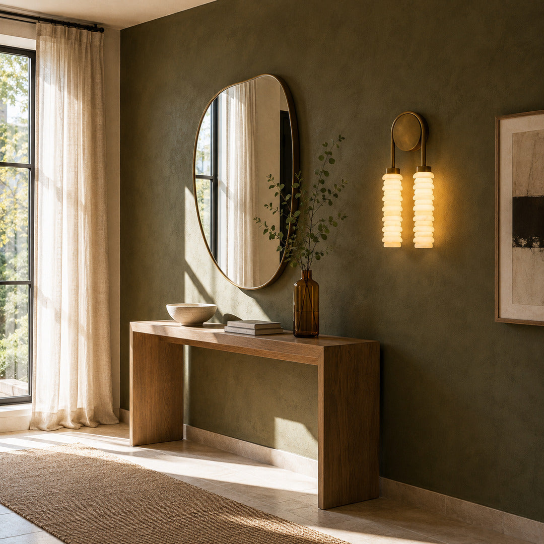 Duetto alabaster wall sconces flanking a vanity mirror in a dry powder room