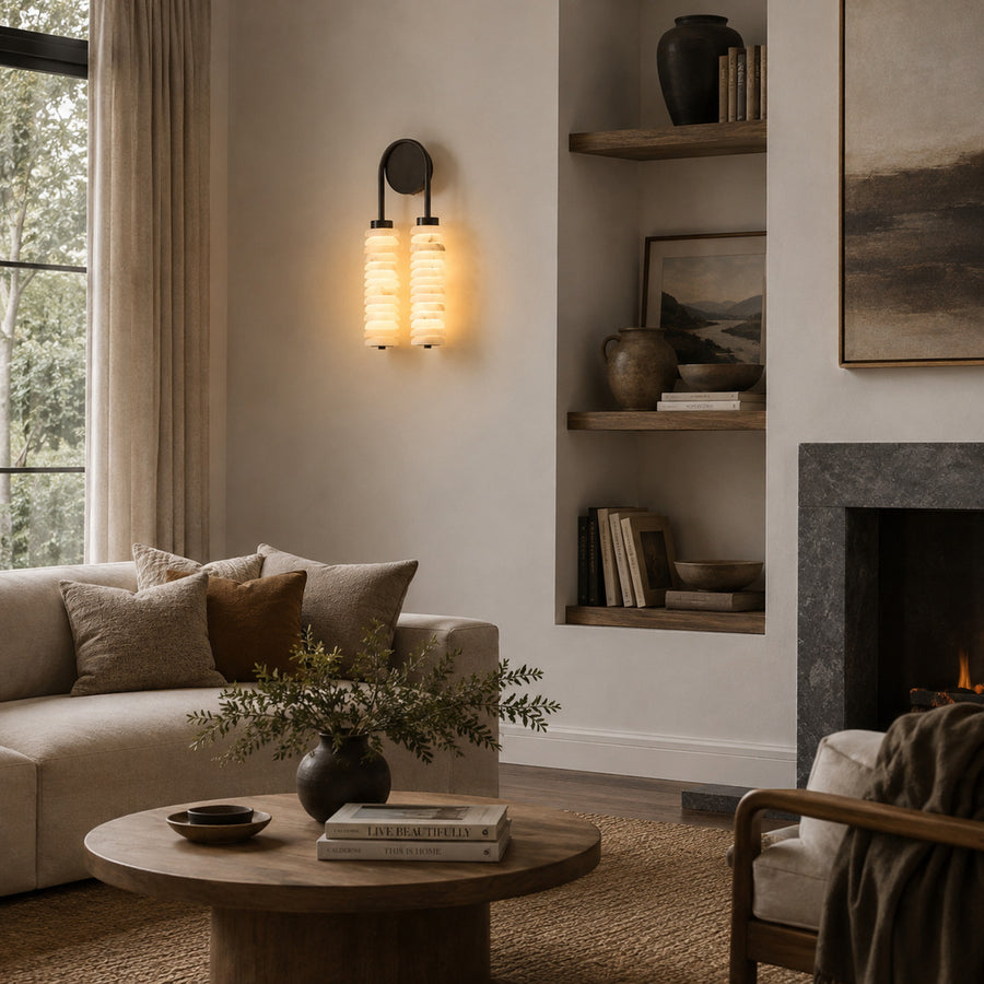 Duetto alabaster wall sconce as a warm sculptural accent on a modern living room feature wall