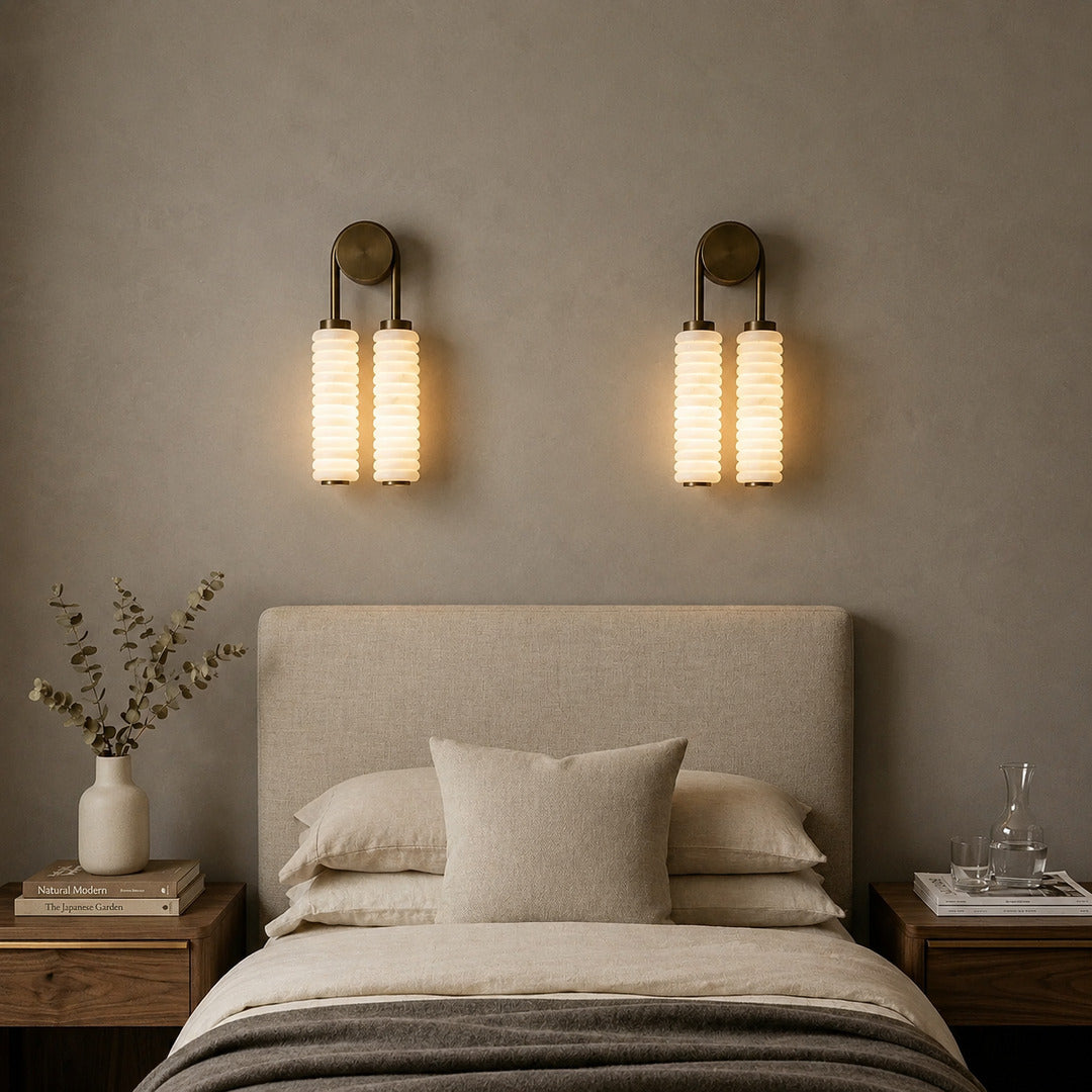 Duetto alabaster wall sconce above a boutique hotel room headboard as a designer accent