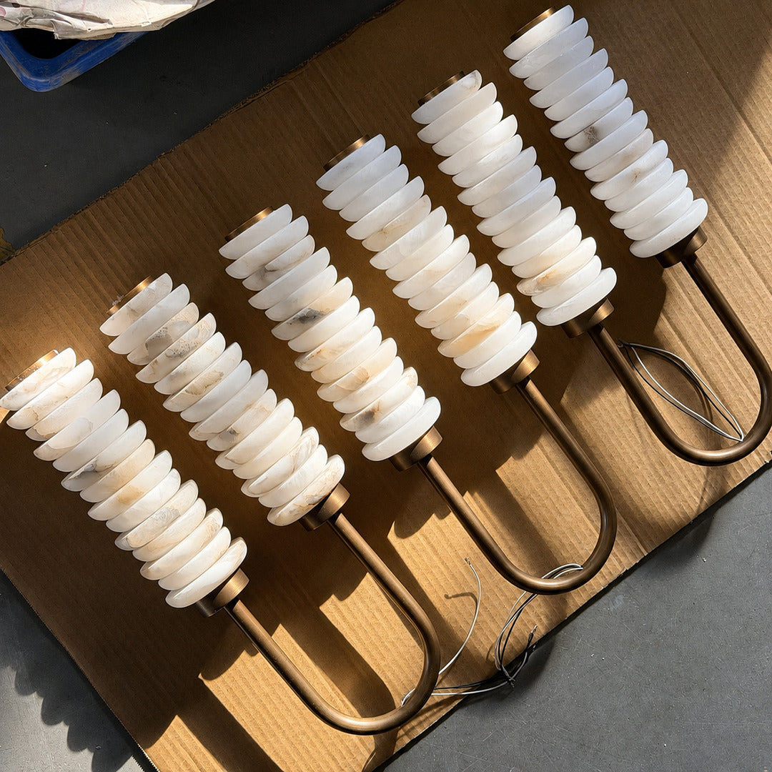 Close-up of the two parallel ribbed alabaster columns on the Duetto wall sconce