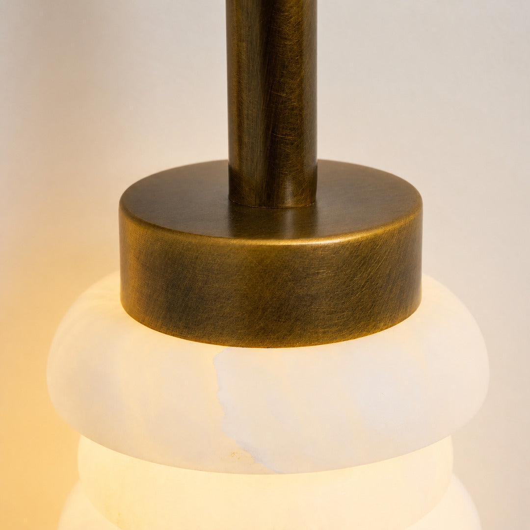 Natural veining and translucency of the alabaster rings on the Duetto wall sconce, unique to each piece