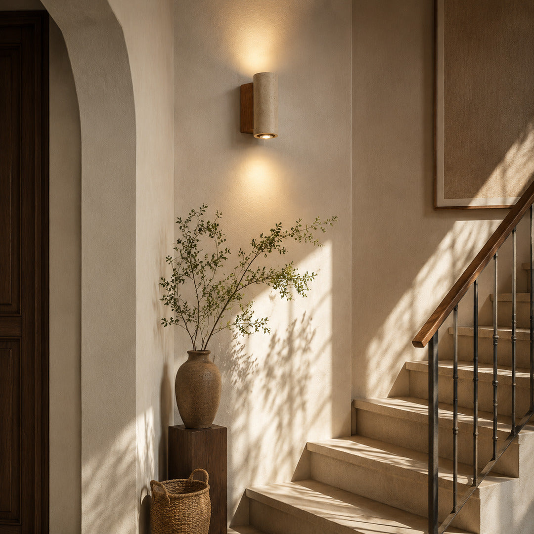 Duplo travertine wall sconce staircase stairwell up down warm glow travertine stone American home lifestyle interior styled