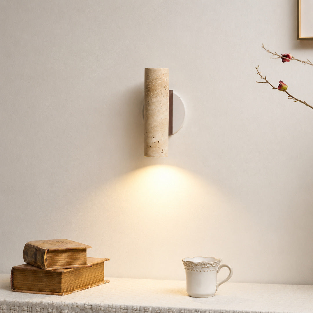 Duplo travertine wall sconce entryway foyer warm glow travertine stone up down American home lifestyle interior styled