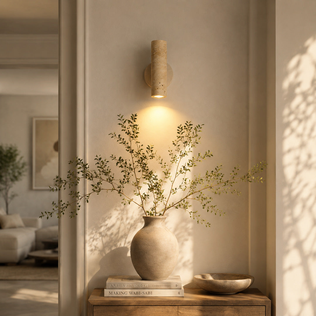 Duplo travertine wall sconce entryway foyer warm glow travertine stone up down American home lifestyle interior styled