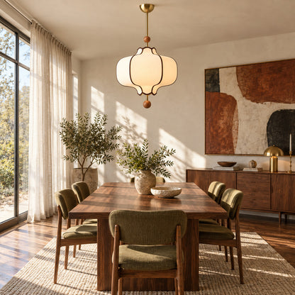 Dynasty lantern pendant light casting a warm glow over a dining table in a transitional interior