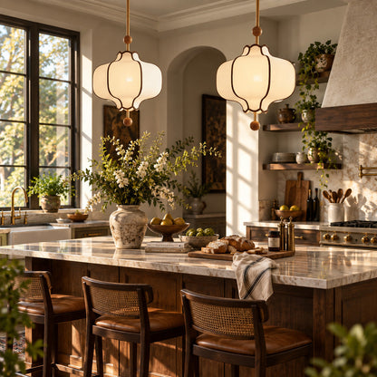 Dynasty lantern pendant light suspended over a kitchen island as a fabric statement fixture