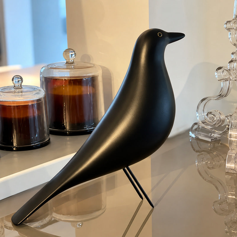 Close-up of the long-legged silhouette and smooth form of the Eames House Bird sculpture
