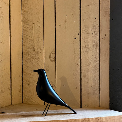 Eames House Bird sculpture welcoming guests as a decorative accent on an entryway console