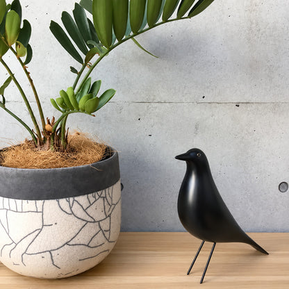 Eames House Bird sculpture welcoming guests as a decorative accent on an entryway console