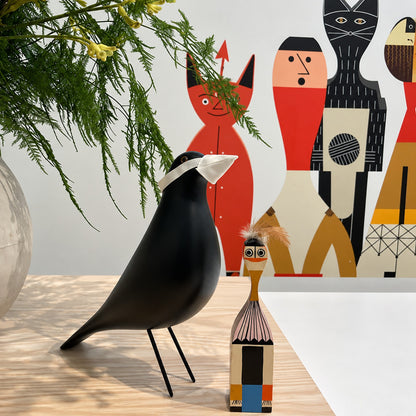 Eames House Bird sculpture styled as a decorative accent on a modern living room bookshelf
