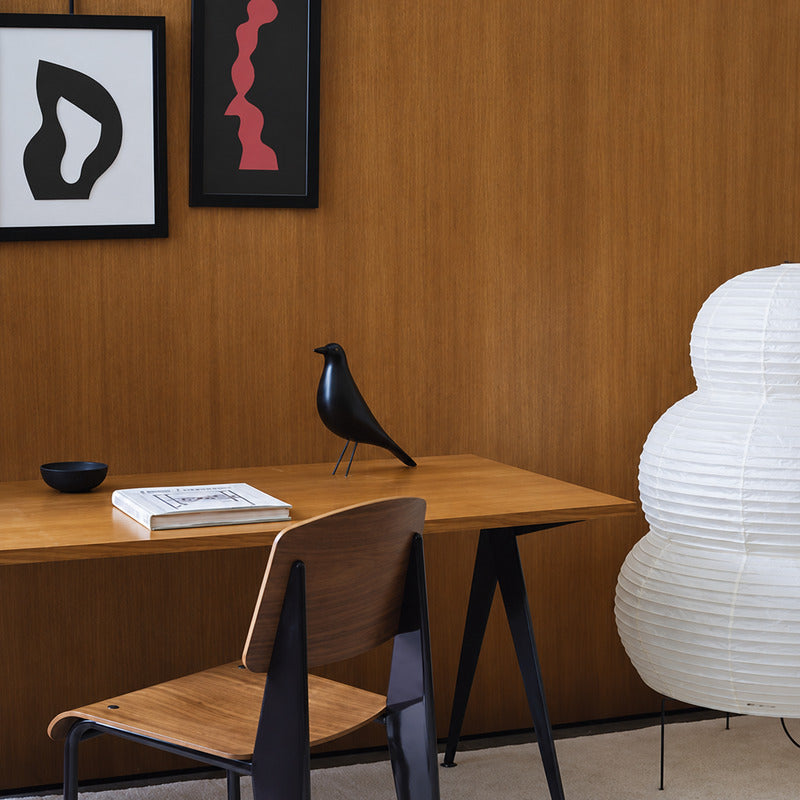 Eames House Bird sculpture brightening a home office desk as a designer ornament