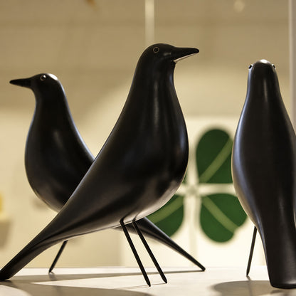 Close-up of the long-legged silhouette and smooth form of the Eames House Bird sculpture