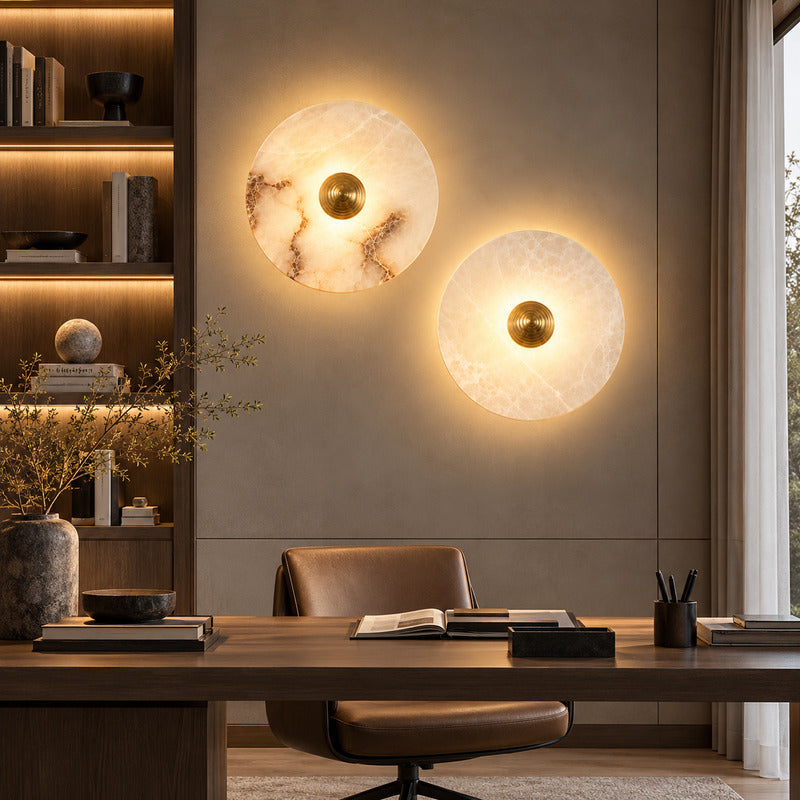 Eclisse alabaster wall sconce with its fluted brass accent adding an art deco touch to a refined wall