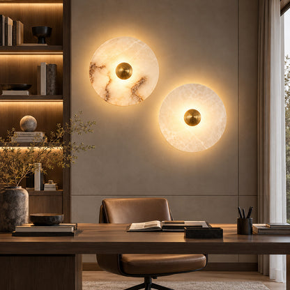 Eclisse alabaster wall sconce with its fluted brass accent adding an art deco touch to a refined wall