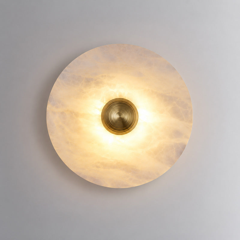 Medium 9.8-inch gold Eclisse alabaster wall sconce on a modern hallway wall