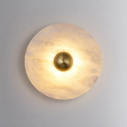 Medium 9.8-inch gold Eclisse alabaster wall sconce on a modern hallway wall