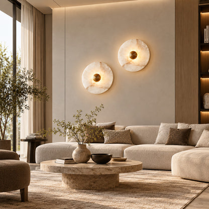 Eclisse alabaster wall sconce as a warm sculptural accent on a modern living room wall