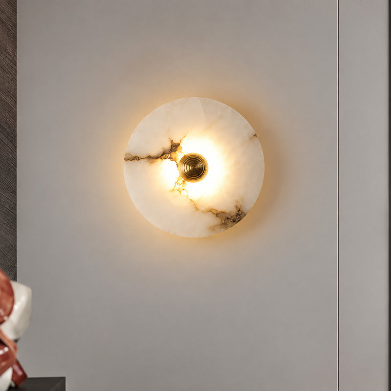 Eclisse alabaster wall sconce as a warm sculptural accent on a modern living room wall