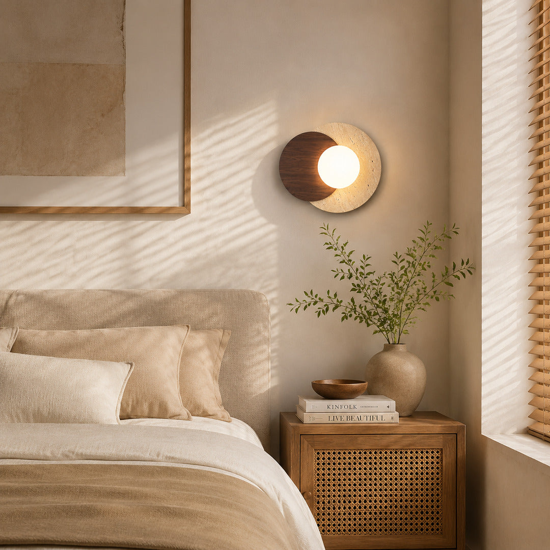 Eclisse travertine wall sconce bedroom bedside warm glow white glass globe travertine stone wood minimalist American home lifestyle interior styled
