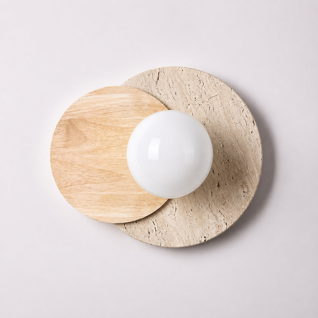 Eclisse travertine wall sconce white glass globe yellow travertine stone wood base minimalist sculptural white background