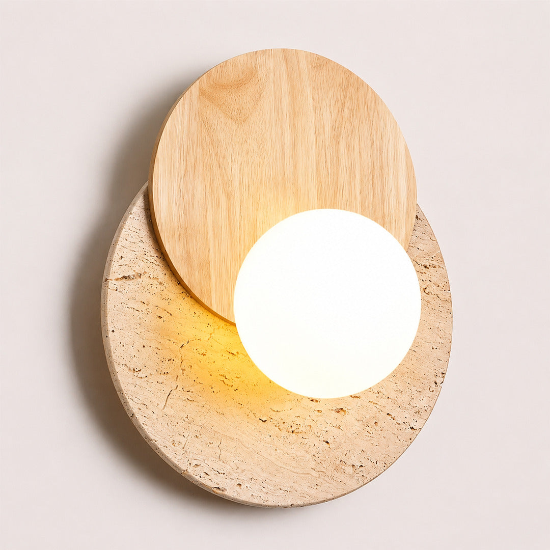 Eclisse travertine wall sconce white glass globe yellow travertine stone wood base minimalist sculptural white background