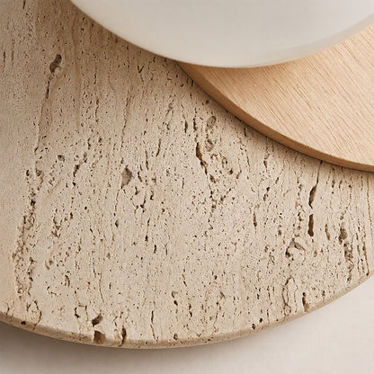 Eclisse travertine wall sconce yellow travertine natural stone veining porous texture base detail close up unique