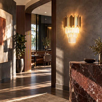 Empire crystal wall sconce welcoming guests with a dazzling glow above an entry console
