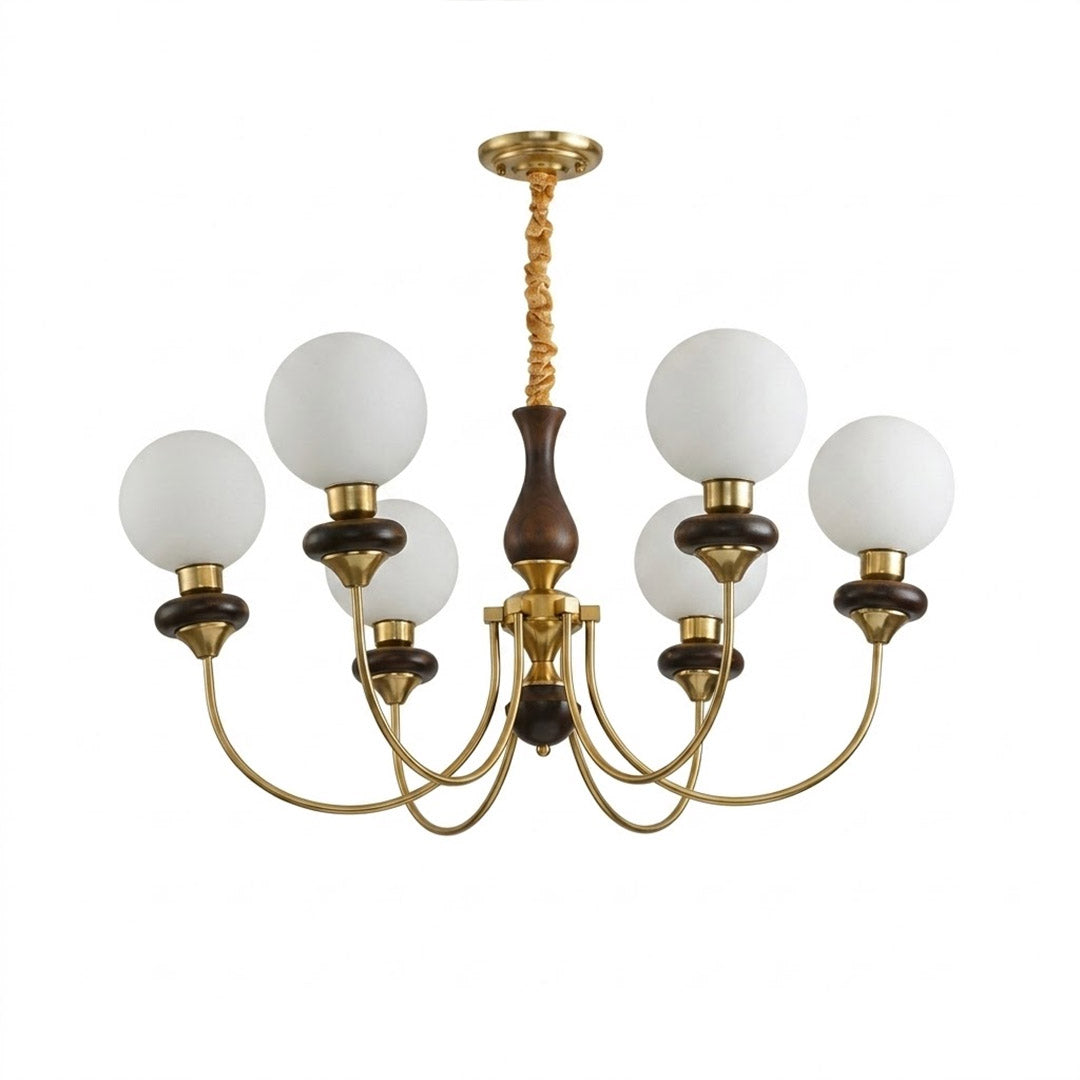 Estelle wood glass chandelier above dining table warm Edison filament glow French farmhouse interior