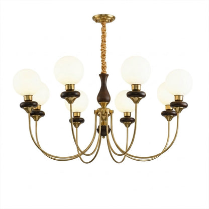 Estelle wood glass chandelier above dining table warm Edison filament glow French farmhouse interior
