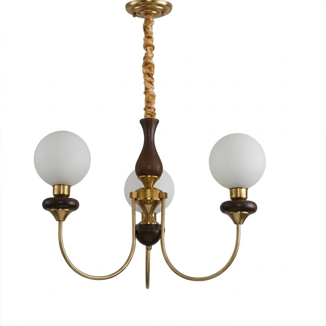 Estelle wood glass chandelier above dining table warm Edison filament glow French farmhouse interior