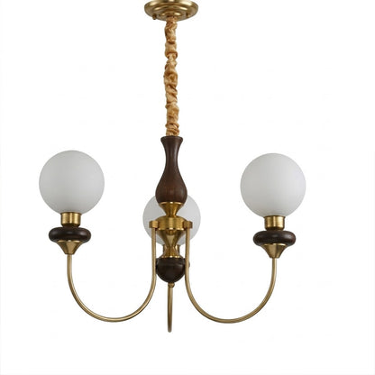 Estelle wood glass chandelier above dining table warm Edison filament glow French farmhouse interior