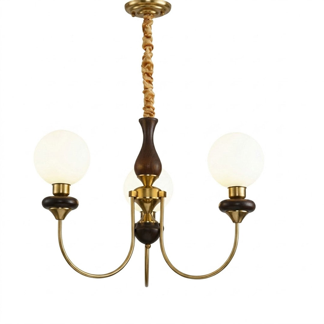 Estelle wood glass chandelier above dining table warm Edison filament glow French farmhouse interior