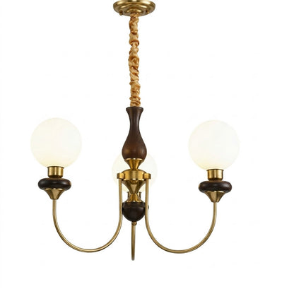 Estelle wood glass chandelier above dining table warm Edison filament glow French farmhouse interior