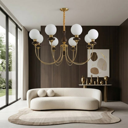 Estelle wood glass chandelier above dining table warm Edison filament glow French farmhouse interior