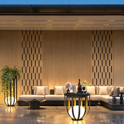 Faceta outdoor garden lights framing a modern commercial building landscape at dusk