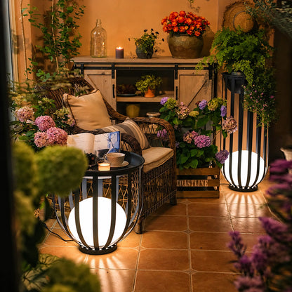 Faceta outdoor garden light adding a warm geometric glow to a backyard patio at night