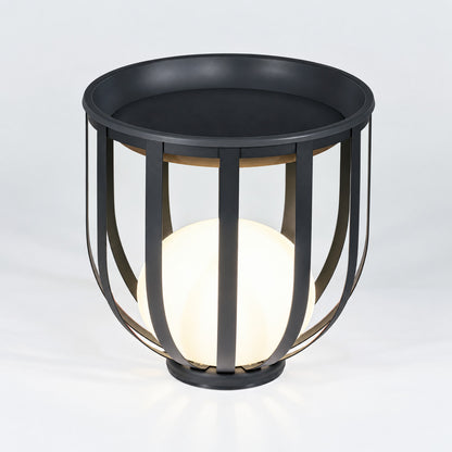 Low 21.3-inch hardwired Faceta outdoor garden light on a patio surface