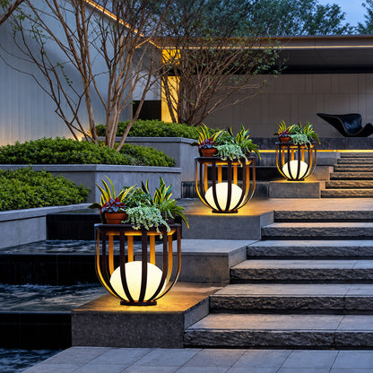 Pair of Faceta outdoor garden lights framing a front entrance with a warm geometric glow