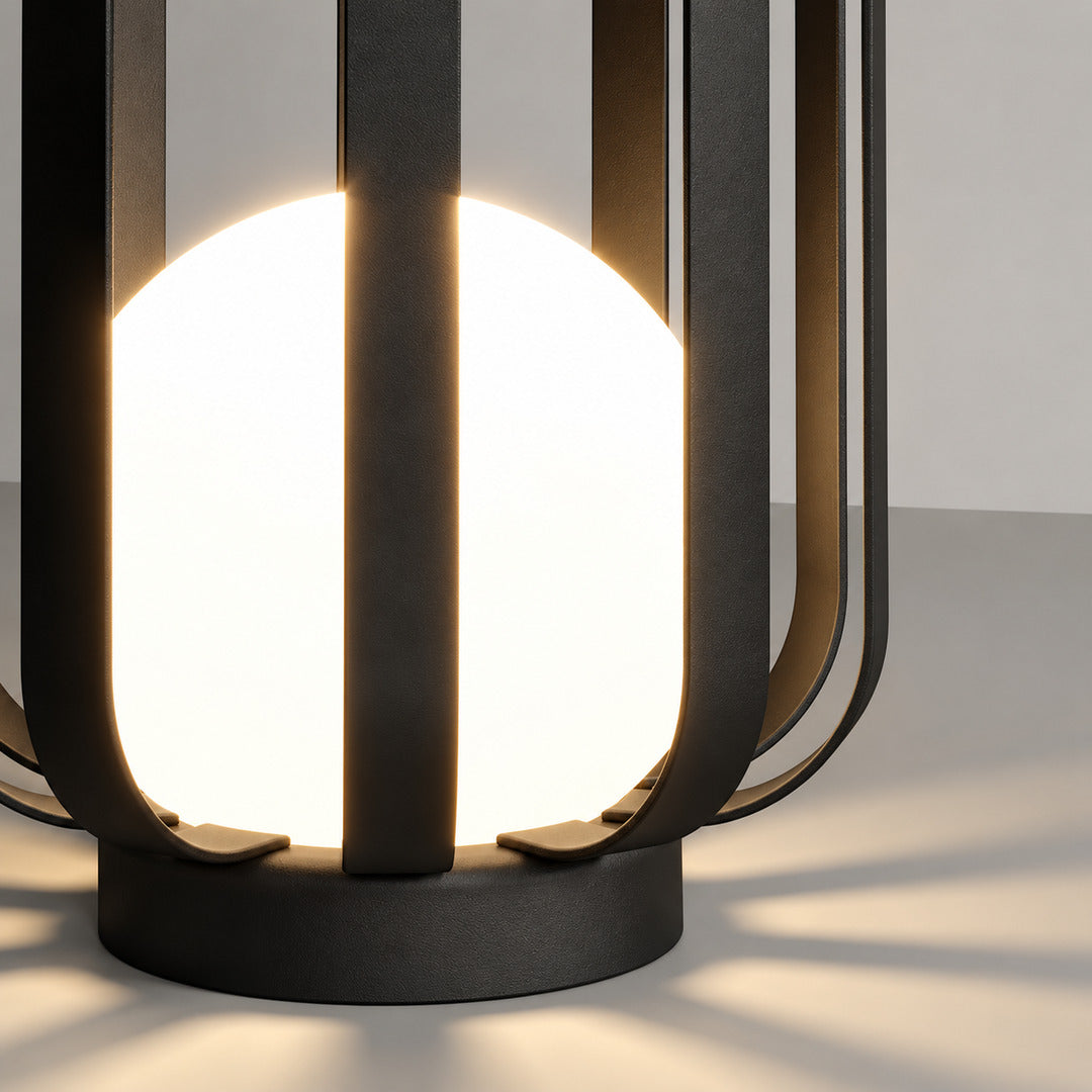 Warm light glowing through the translucent faceted panels of the Faceta outdoor garden light